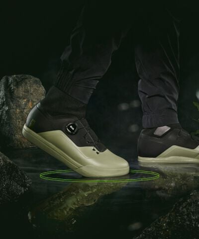 Speedframe bike helmet floating with vegetation in the back