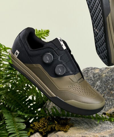 Speedframe bike helmet floating with vegetation in the back