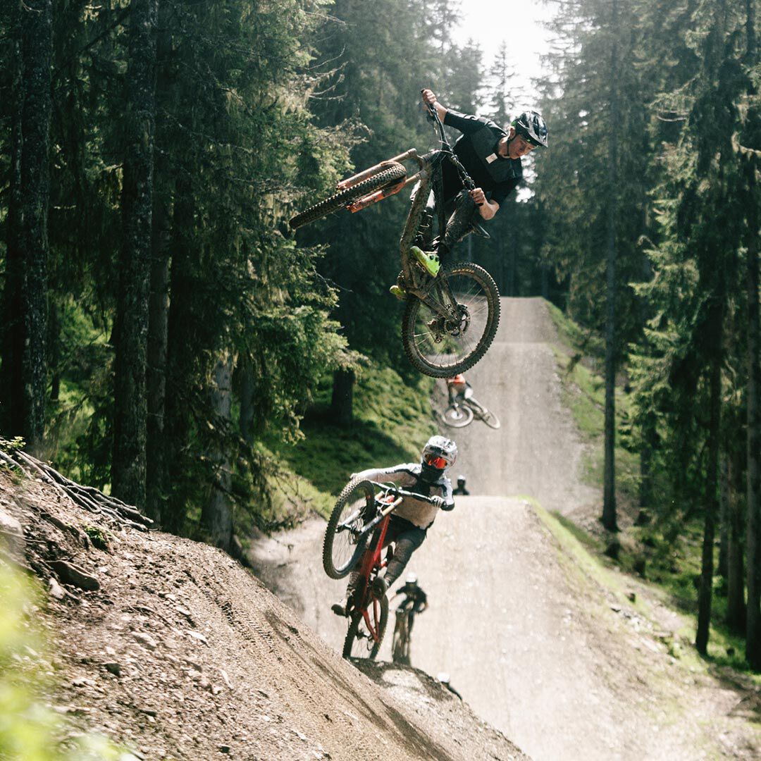 Wring out a cloth over a bucket.