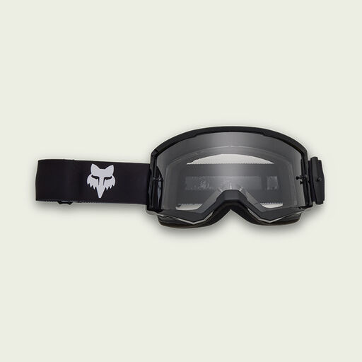 Black goggles on green background