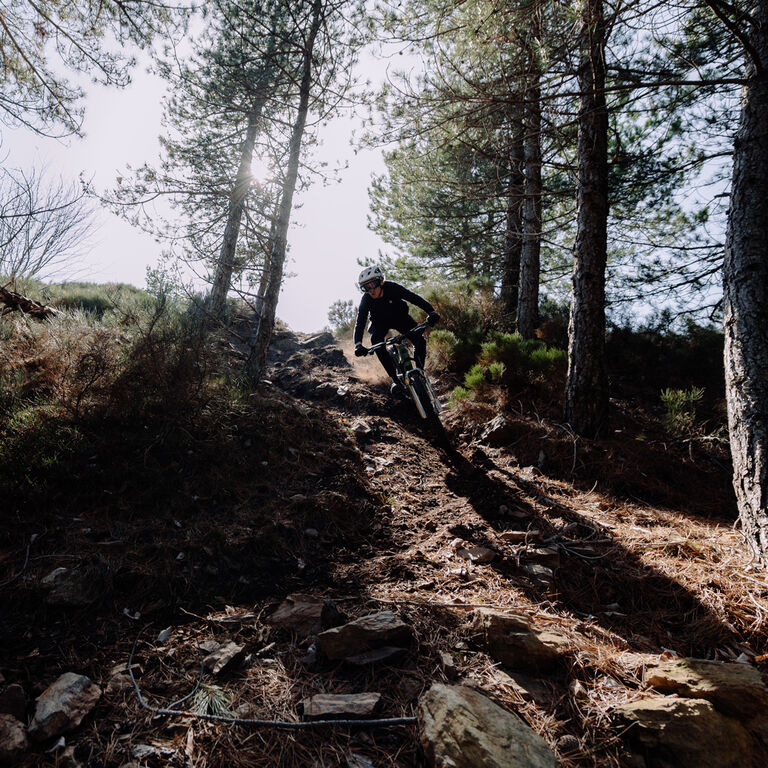 Riding on a descending a steep hill.